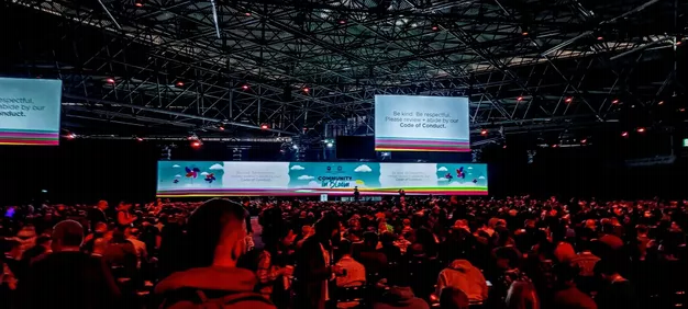 Photo of keynote room at KubeCon and CloudNativeCon Europe 2023, tightly packed with people
